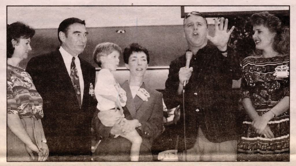 photo of old newspaper photo with group of people