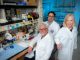 People in a lab posing for camera