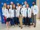 group of medical students pose for camera